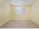 Bedroom with a ceiling fan, tile flooring and two windows for natural light at 3517 Colby Creek Ave, North Las Vegas, NV 89081