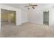 Bright bedroom with neutral carpet, ceiling fan, and walk-in closet at 3517 Colby Creek Ave, North Las Vegas, NV 89081