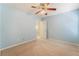 Light blue bedroom with a ceiling fan and access to additional rooms at 3517 Colby Creek Ave, North Las Vegas, NV 89081