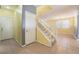 Entryway with carpeted stairs, tile floors, and a coat closet for storage at 3517 Colby Creek Ave, North Las Vegas, NV 89081