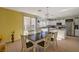 Modern kitchen with white cabinets, stainless steel appliances, and island at 3517 Colby Creek Ave, North Las Vegas, NV 89081