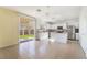 Bright kitchen with white cabinets, stainless steel appliances, and sliding door access to the backyard at 3517 Colby Creek Ave, North Las Vegas, NV 89081