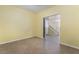 Living room leading to carpeted staircase and upstairs hallway with neutral tile flooring at 3517 Colby Creek Ave, North Las Vegas, NV 89081