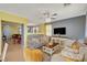 Open living room features a grey couch and white cabinets at 3517 Colby Creek Ave, North Las Vegas, NV 89081