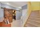 Staircase with wooden banister and barn door at 3517 Colby Creek Ave, North Las Vegas, NV 89081