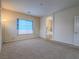 Spacious bedroom with carpet, large window, and en-suite bathroom at 372 Monique Springs St, Henderson, NV 89014