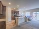 Open concept kitchen and living area with island and sliding glass door at 372 Monique Springs St, Henderson, NV 89014