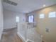 Upstairs hallway with carpeted floor and white railings at 372 Monique Springs St, Henderson, NV 89014