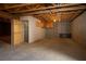 Unfinished basement with open space, concrete floors, and built-in shelving at 3900 W Landberg Ave, Las Vegas, NV 89141