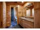 Bathroom with wood cabinets, granite vanity, and slate tile floors at 3900 W Landberg Ave, Las Vegas, NV 89141