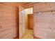 Small closet with wood walls and floors, easily accessible from the bedroom at 3900 W Landberg Ave, Las Vegas, NV 89141