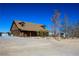 Log home exterior showcasing its unique rustic design at 3900 W Landberg Ave, Las Vegas, NV 89141