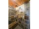 Large walk-in shower with slate tile and built-in seat at 3900 W Landberg Ave, Las Vegas, NV 89141