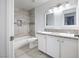 Updated bathroom with double vanity and tile shower at 3939 Springhill Ave, Las Vegas, NV 89121