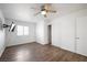 Bedroom with wood-look floors, ceiling fan and closet at 3939 Springhill Ave, Las Vegas, NV 89121