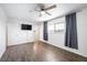 Bright bedroom with laminate flooring, ceiling fan, and large window at 3939 Springhill Ave, Las Vegas, NV 89121