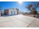 House exterior with large driveway and mature tree at 3939 Springhill Ave, Las Vegas, NV 89121