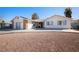 Front view of single story home with gravel landscaping at 3939 Springhill Ave, Las Vegas, NV 89121