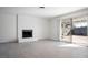 Living room with white brick fireplace and sliding glass doors at 3939 Springhill Ave, Las Vegas, NV 89121