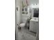 Cozy powder room with white vanity, modern toilet, and decorative wall accents at 4030 Allyson Rae St, North Las Vegas, NV 89032