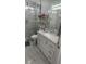 Bathroom with a white vanity, marble flooring, and a shower at 4030 Allyson Rae St, North Las Vegas, NV 89032