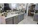 Kitchen featuring light gray cabinets, stainless steel appliances, and marble tile flooring at 4030 Allyson Rae St, North Las Vegas, NV 89032