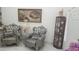 Sitting area with decorative chairs and ornate display case at 4030 Allyson Rae St, North Las Vegas, NV 89032