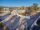 Aerial view of a house with a large yard and covered patio at 4300 San Mateo St, North Las Vegas, NV 89032