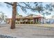 Covered patio with seating area and potted plants at 4300 San Mateo St, North Las Vegas, NV 89032