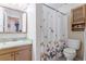 Bathroom with shower/tub combo and butterfly shower curtain at 4300 San Mateo St, North Las Vegas, NV 89032