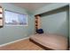 Light and airy bedroom with built-in shelving and wood flooring at 4300 San Mateo St, North Las Vegas, NV 89032