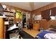 Small bedroom with wood-paneled walls, a double bed, and built-in shelving at 4300 San Mateo St, North Las Vegas, NV 89032