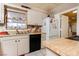 Bright kitchen features ample cabinetry and a butcher block countertop at 4300 San Mateo St, North Las Vegas, NV 89032