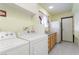 Laundry room with washer, dryer, and utility sink at 4300 San Mateo St, North Las Vegas, NV 89032