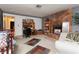 Living room with stone fireplace and built-in shelving at 4300 San Mateo St, North Las Vegas, NV 89032