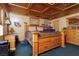 Main bedroom with wood-paneled ceiling and large bed at 4300 San Mateo St, North Las Vegas, NV 89032