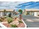 Gated community entrance with landscaping and fountain at 4773 Big Draw Dr, North Las Vegas, NV 89031