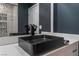 Modern bathroom with black vessel sink and gray walls at 4825 Greencreek Dr, Las Vegas, NV 89110