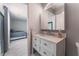 Bathroom with white vanity and mirrored cabinet at 4825 Greencreek Dr, Las Vegas, NV 89110