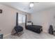 Bedroom with twin bed and black accent chair at 4825 Greencreek Dr, Las Vegas, NV 89110