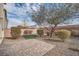 Landscaped backyard with patio and artificial turf at 4944 Guysborough St, Las Vegas, NV 89148