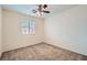 Bright bedroom with ceiling fan and window coverings at 4944 Guysborough St, Las Vegas, NV 89148