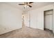 Spacious bedroom with ceiling fan and access to laundry at 4944 Guysborough St, Las Vegas, NV 89148