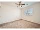 Well-lit bedroom with ceiling fan and neutral carpet at 4944 Guysborough St, Las Vegas, NV 89148