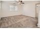 Upstairs bedroom with window and ceiling fan at 4944 Guysborough St, Las Vegas, NV 89148