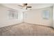 Spacious bedroom with ceiling fan and neutral carpeting at 4944 Guysborough St, Las Vegas, NV 89148