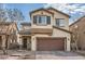 Two-story house with brown garage door and brick walkway at 4944 Guysborough St, Las Vegas, NV 89148