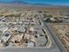 Aerial view of a house and neighborhood in a desert climate at 5001 Ray Frank Blvd, Pahrump, NV 89060