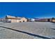 Large gravel area with an RV and storage shed at 5001 Ray Frank Blvd, Pahrump, NV 89060