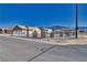 Single story home with a large yard and white fence at 5001 Ray Frank Blvd, Pahrump, NV 89060